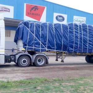 White Truck loaded with a blue tent Trucks Hire in Zimbabwe